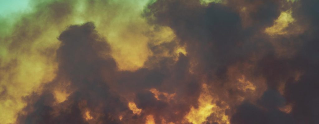 cloudy sky at dusk with smoke